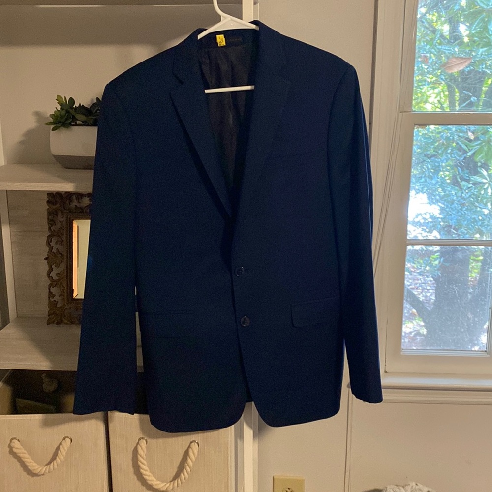 Blue men’s Calvin Klein suit jacket. Pants available as well. Great condition.